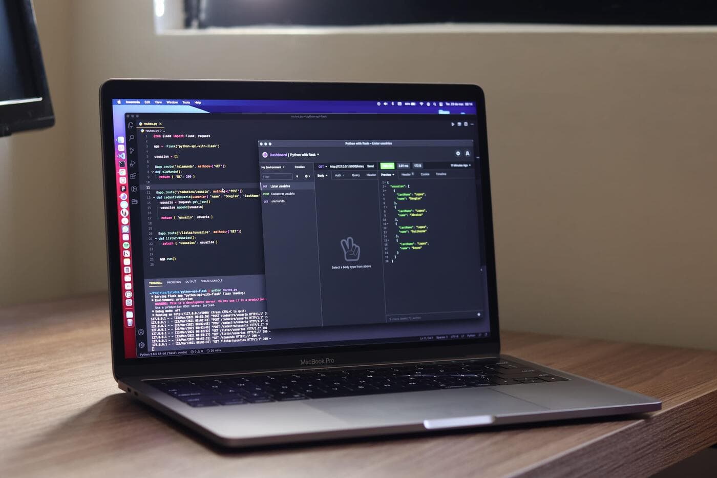Laptop on a desk showing code in an editor