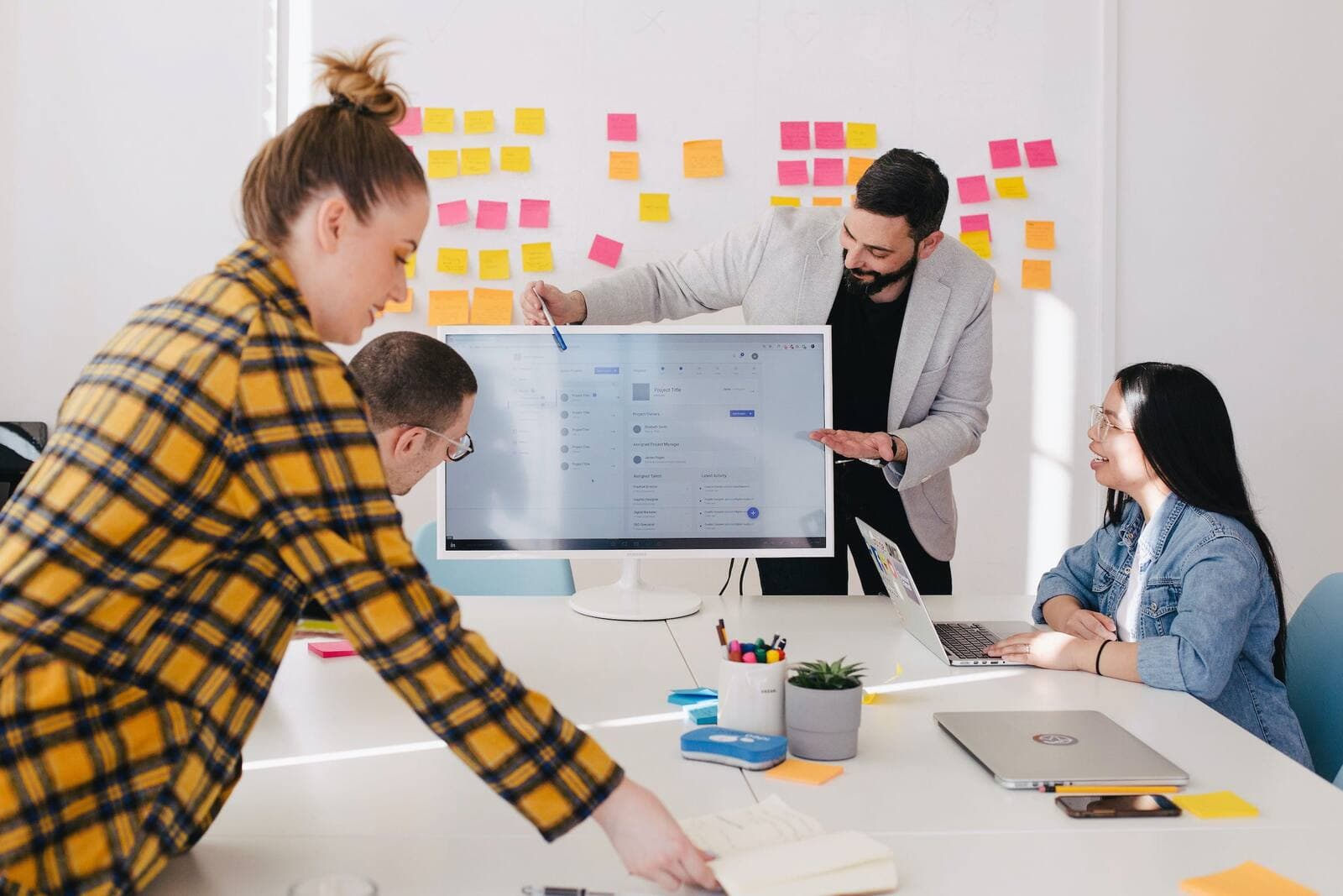Designer and developers reviewing an interface during planning